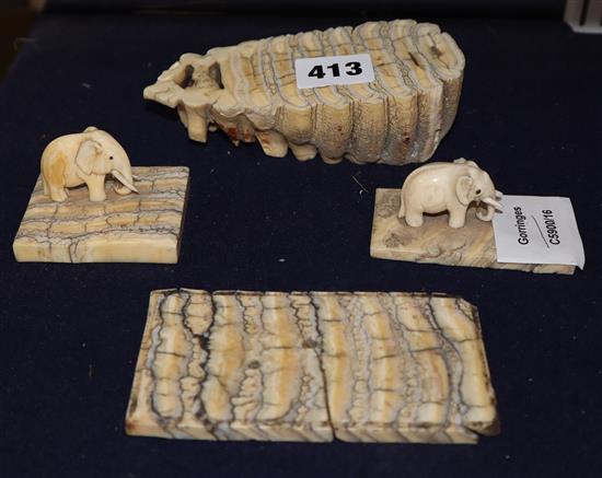 Two ivory elephant figures with elephant tooth stands and two elephant tooth specimens, early 20th century,